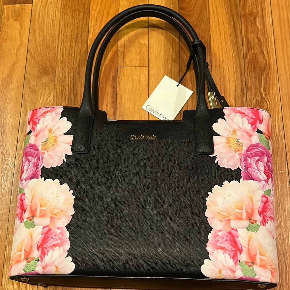 Calvin Klein bag, brand new never used with tags. Black with flower design